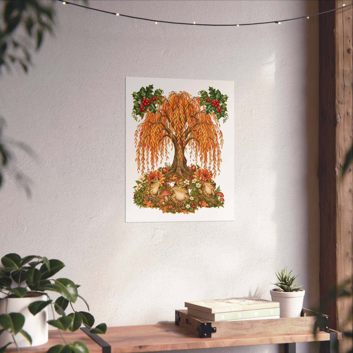 A vertical art print featuring a whimsical tree with golden-orange leaves, sunflowers, hedgehogs, and red berries, displayed on a textured white wall above a wooden console table with plants.