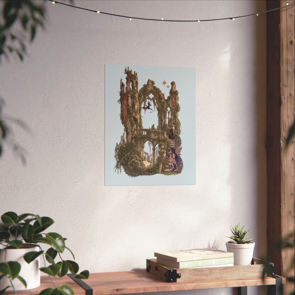A vertical art print featuring a whimsical, fantasy-style illustration of a stone archway and tower structure in earthy greens and browns, set against a pale blue background. The print is displayed on a textured off-white wall above a wooden console table decorated with books, a small succulent, and potted plants.