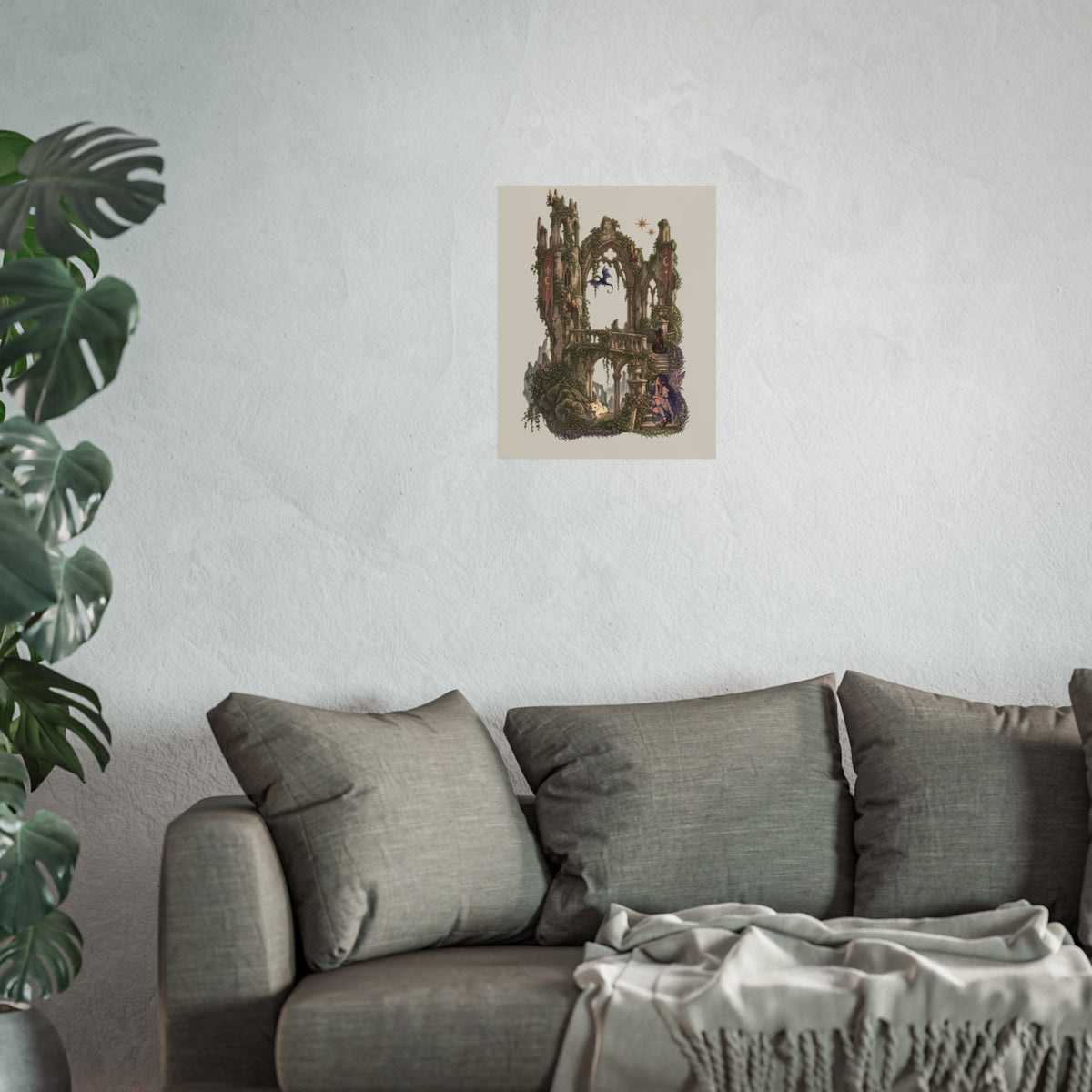 A framed vertical art print featuring a witch character holding lavender, displayed on a textured light gray wall above a gray sofa with pillows and a throw blanket, with a green plant visible on the left.