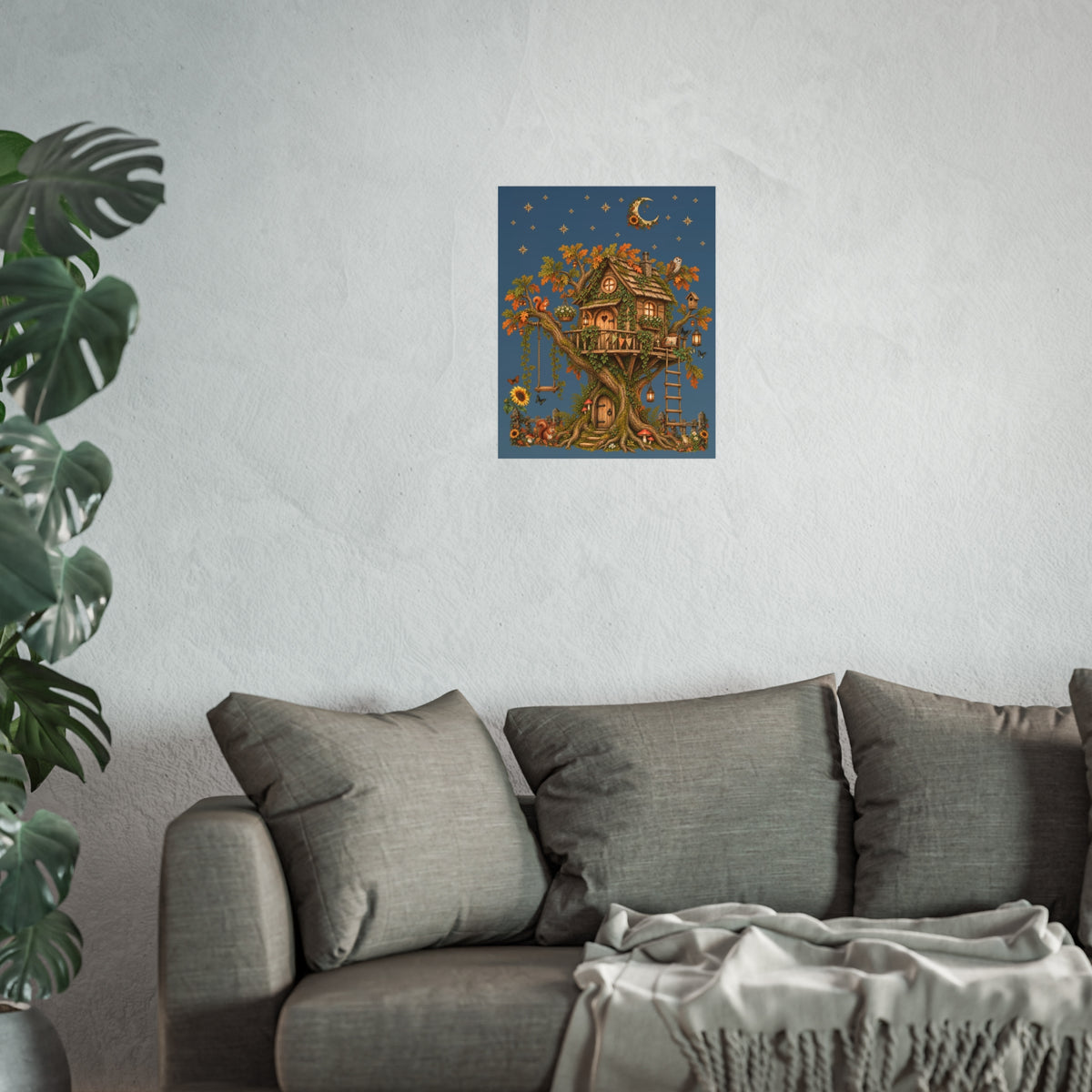Framed artwork on a wall above a sofa with a plant to the left.